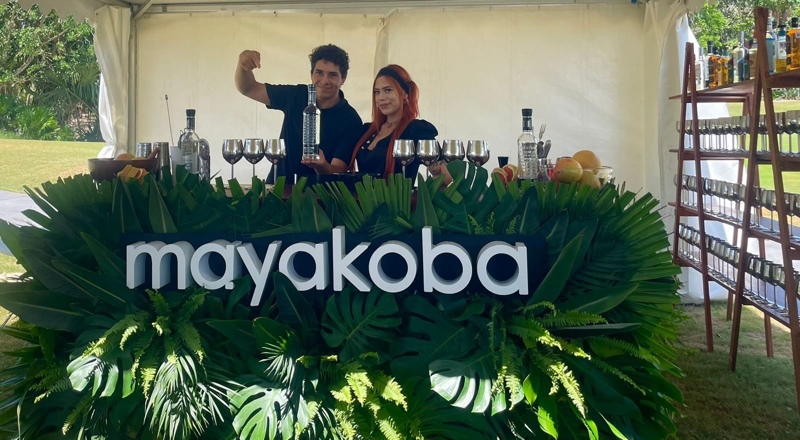 Branded Mayakoba tequila bar activation with staff at a corporate event