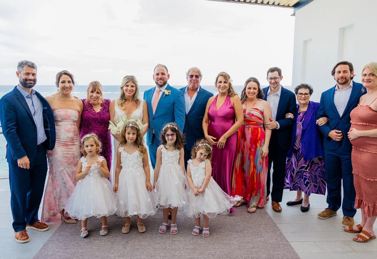 Bride and bridesmaids at a rooftop infinity pool overlooking the Caribbean