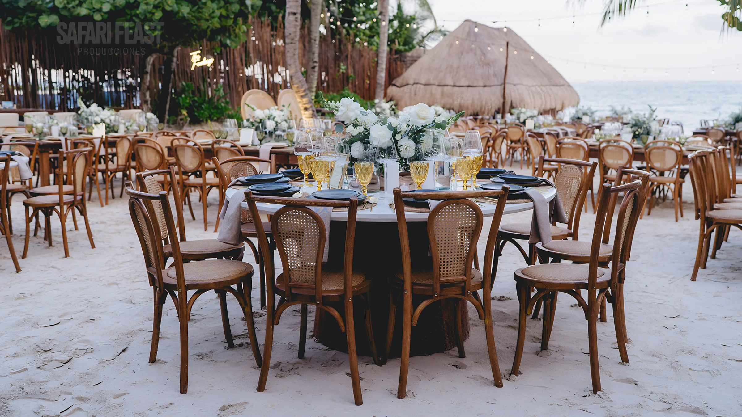 Rooftop destination wedding reception at golden-hour sunset in the Riviera Maya