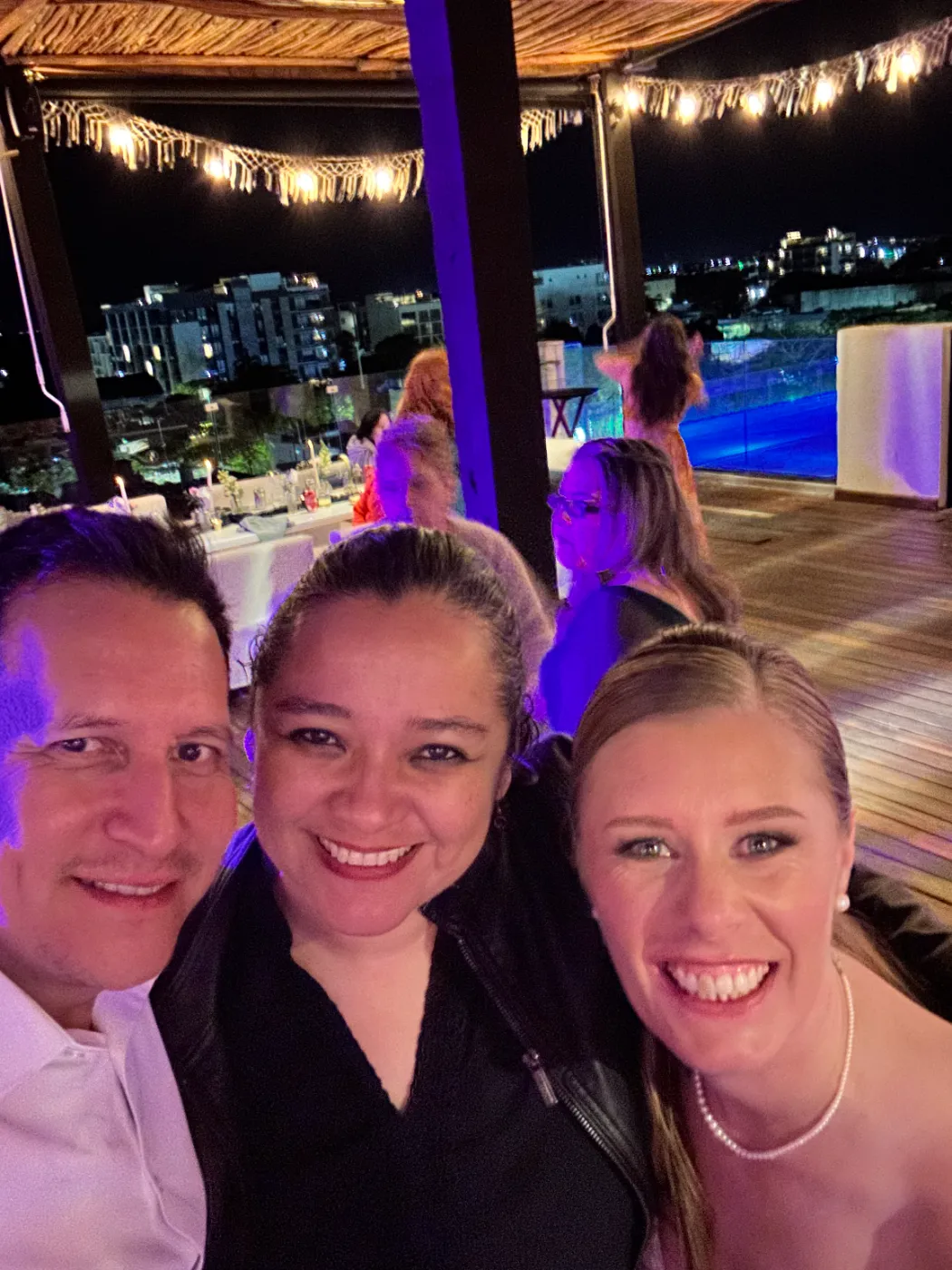 With clients at a rooftop wedding reception