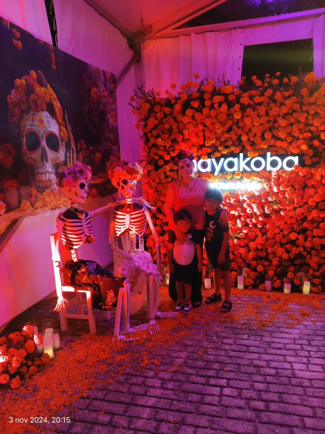 Marigold flower wall with Catrina figures and Mayakoba signage