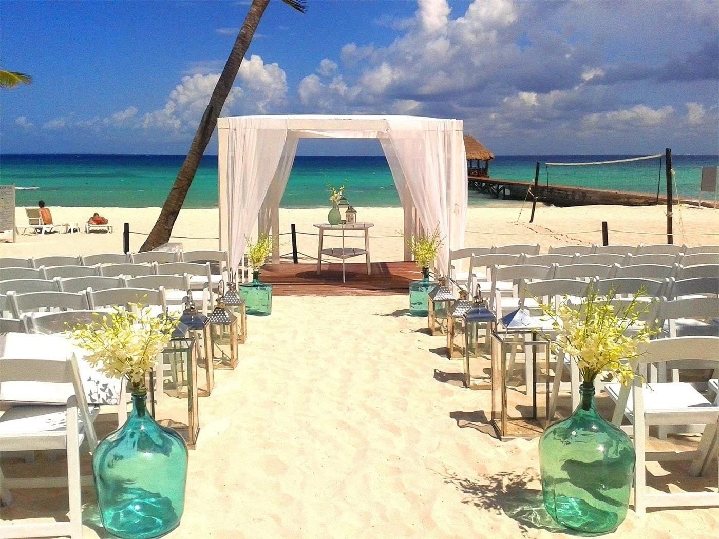 Beachfront wedding cabana setup