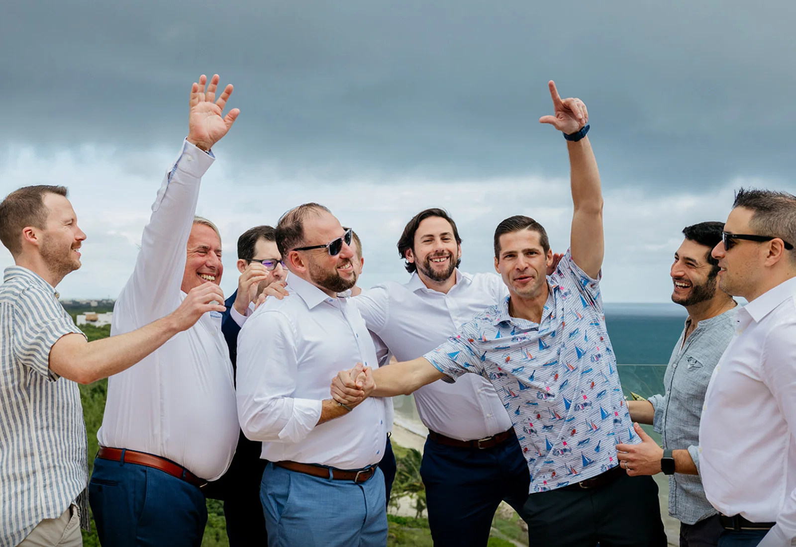 Bachelor party celebration with group of men by the sea