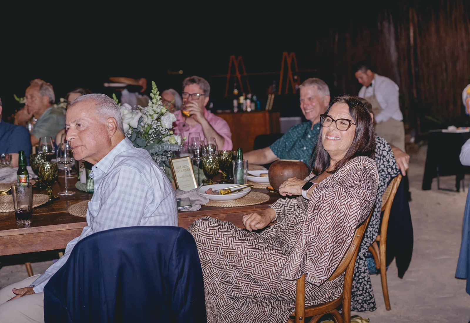 Beachfront dinner celebration at night